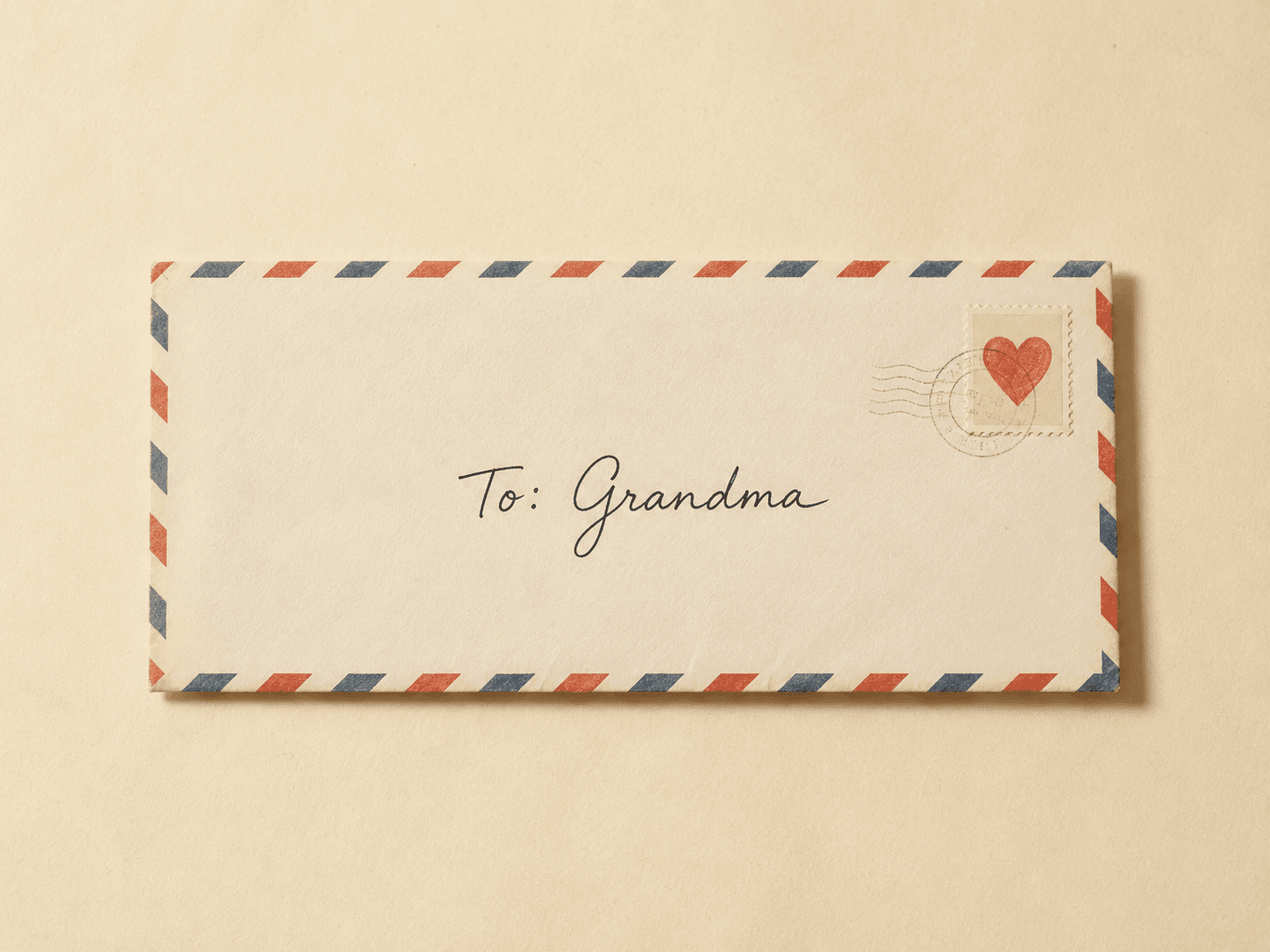 An airmail envelope addressed by hand to Grandma, with a heart stamp in the corner